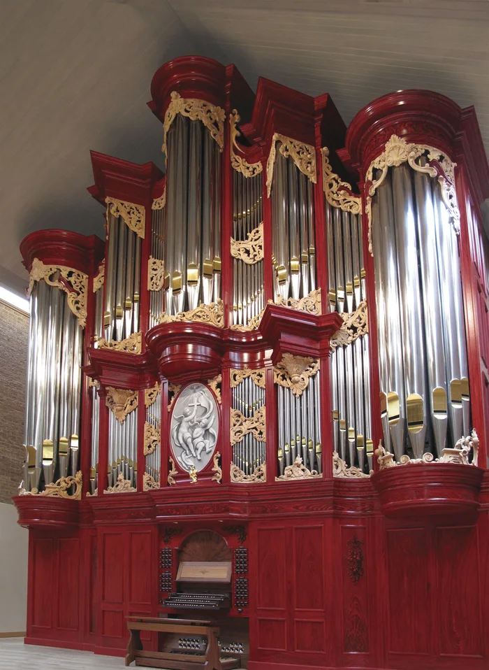Opus 17 in Dallas: an organ case finished in faux bois, painted wood grain.